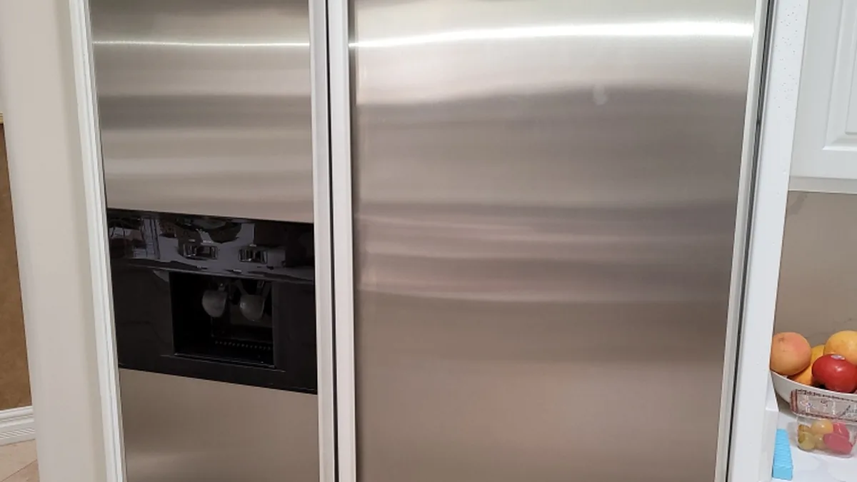Factory-certified appliance repair technician servicing luxury refrigeration, laundry suites, and cooking ranges in Orland Park, IL